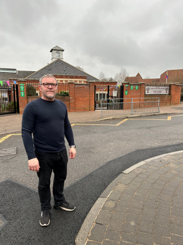 Will outside Holly Trees Primary School